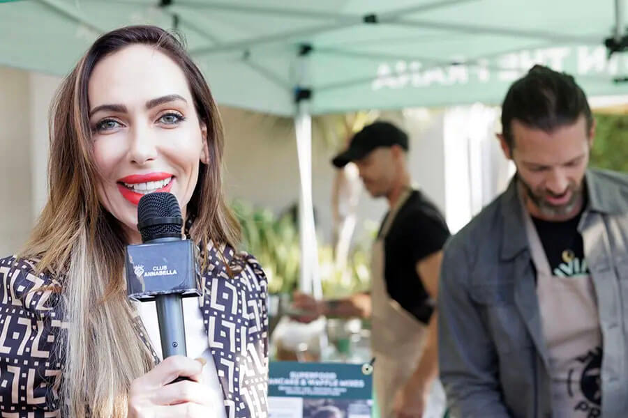 Annabella interviewing an event guest