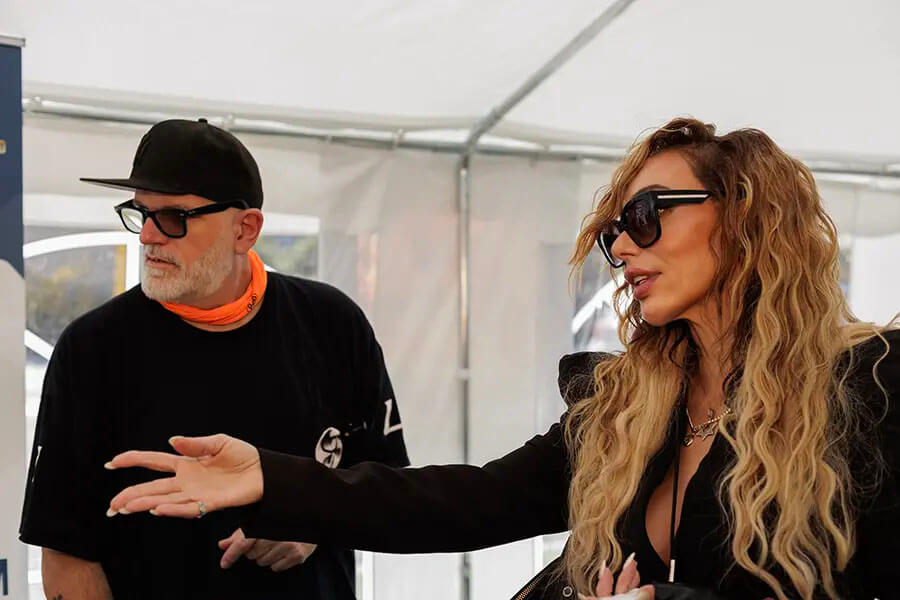 Annabella speaking with an event guest