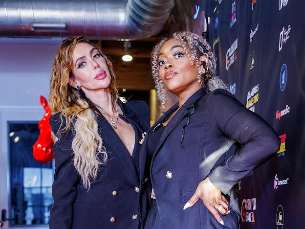 Annabella with a guest on the event carpet