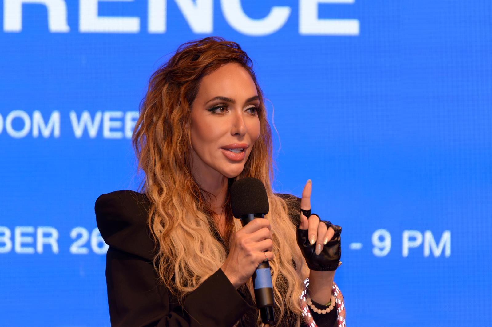 Annabella speaking at a conference
